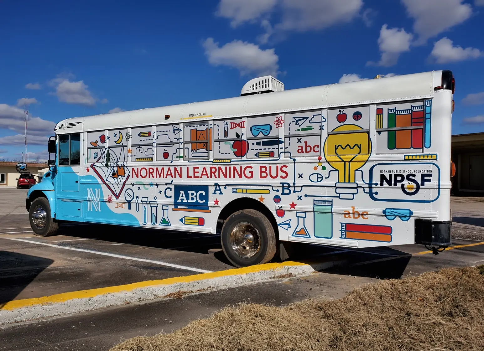 Norman Public Schools Learning Bus wrap, full side view of the finished illustrated design
